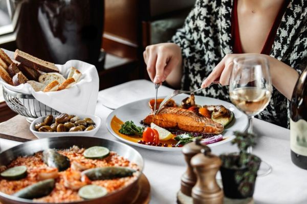 person eating seafood in a restaurant