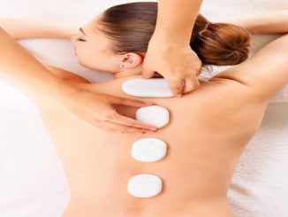 woman having a Massage in Istanbul with hot rocks on her back