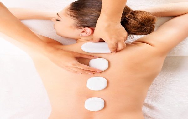 woman having a Massage in Istanbul with hot rocks on her back
