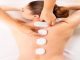 woman having a Massage in Istanbul with hot rocks on her back