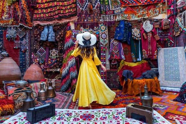 Beautiful girl in traditional carpet shop in turkey