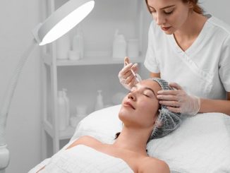 Beautician doing filler injection for client