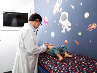 Medium shot doctor consulting baby. Top 3 pediatricians in Istanbul, Turkey