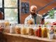 Arab man uses cell phone for eco products. Top 3 places to make the pantry in Istanbul, Turkey