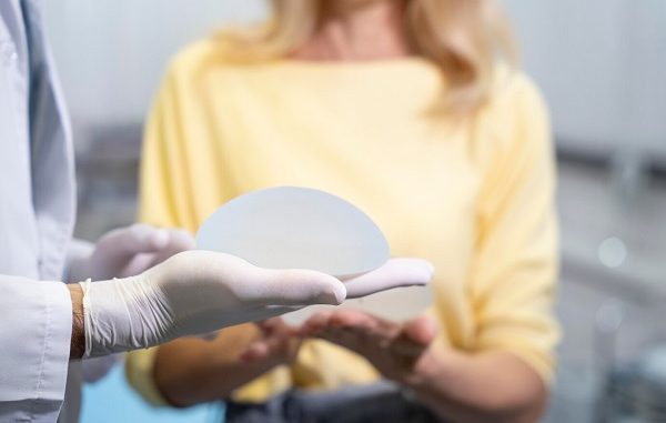Close up hands holding breast implants. Top 10 Best Breast Aesthetics Clinics in Istanbul Turkey