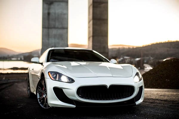 Sport car coupe white street front view. Car rentals in Istanbul