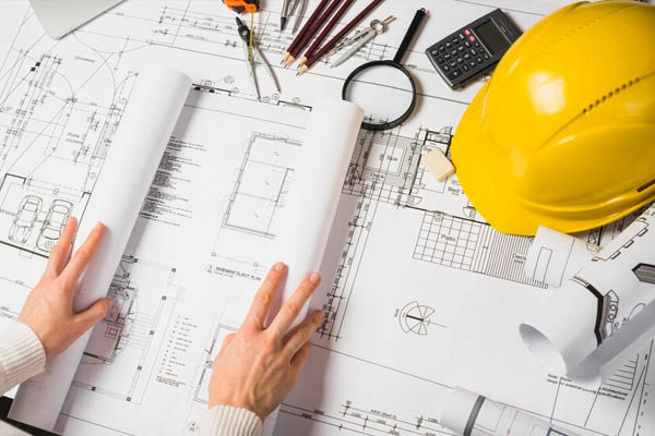 Figure crop architect opening blueprint