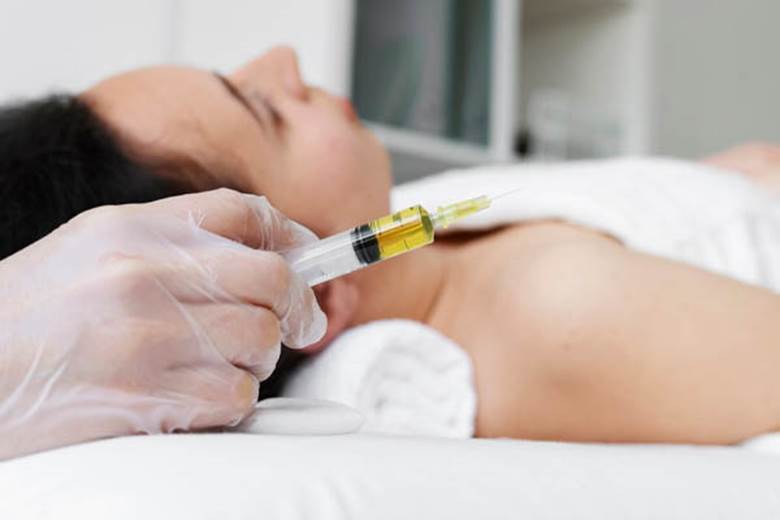 syringe-holding-professional-health-side-view